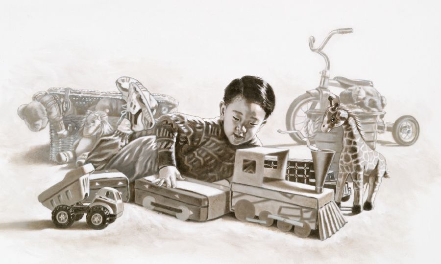 A boy plays with his toys