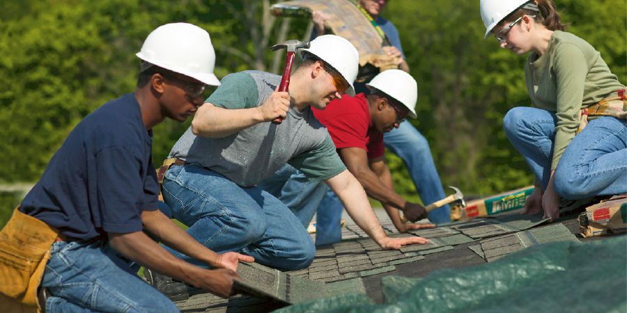 Brothers repair a roof