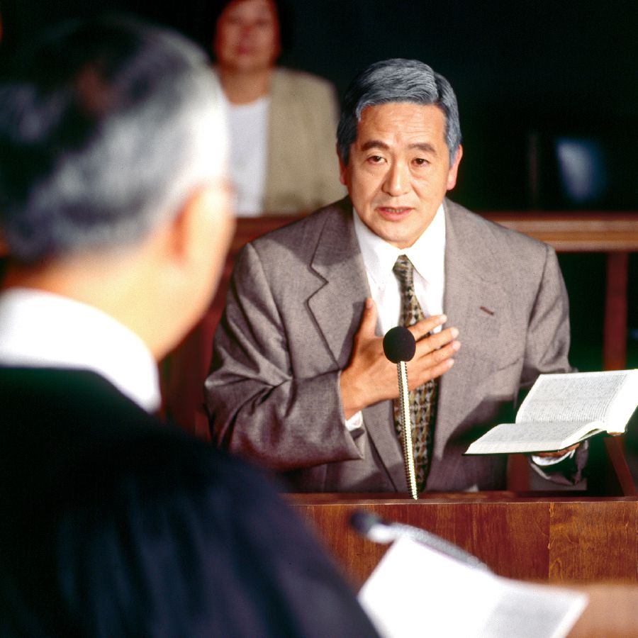 A brother uses a Bible to defend the truth in a courtroom