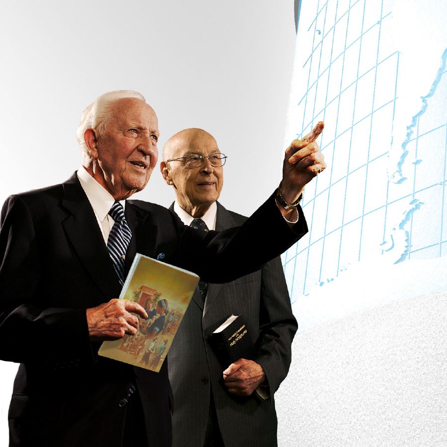 Brothers John Barr and Theodore Jaracz of the Governing Body look at a world map