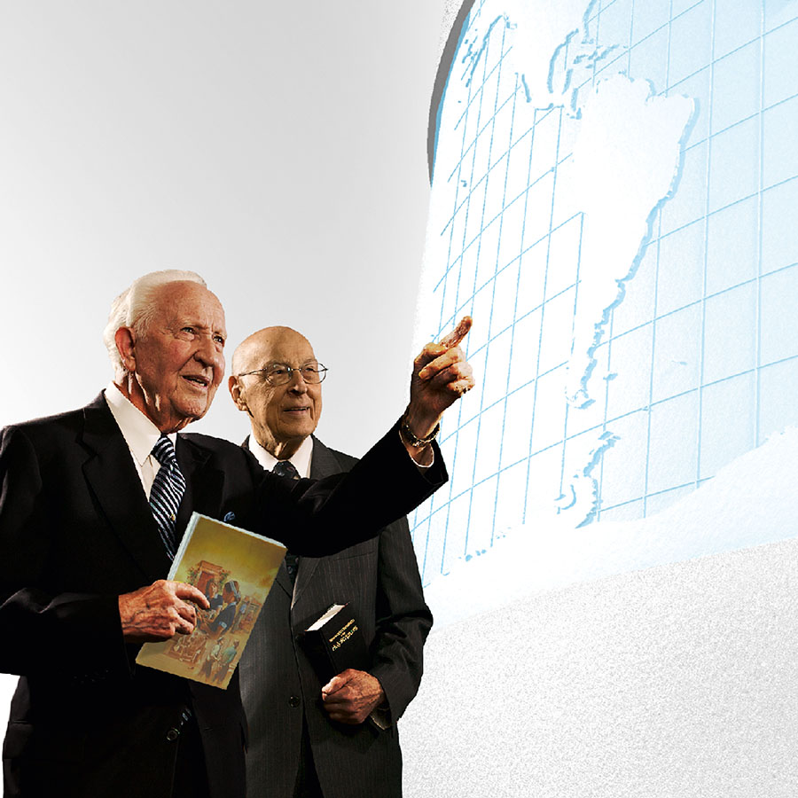 Brothers John Barr and Theodore Jaracz of the Governing Body look at a world map