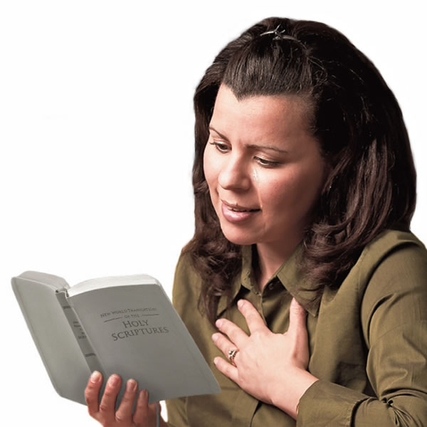 A grieving woman finding comfort from reading the Bible