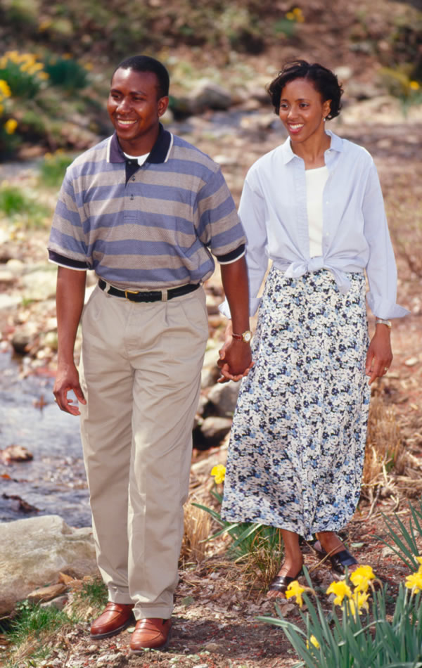 A happy husband and wife taking a pleasant walk together