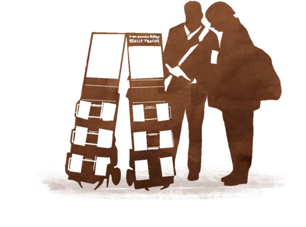 One of Jehovah’s Witnesses preaches to a man standing near public witnessing carts
