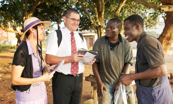 Katy and Eric preaching in Benin