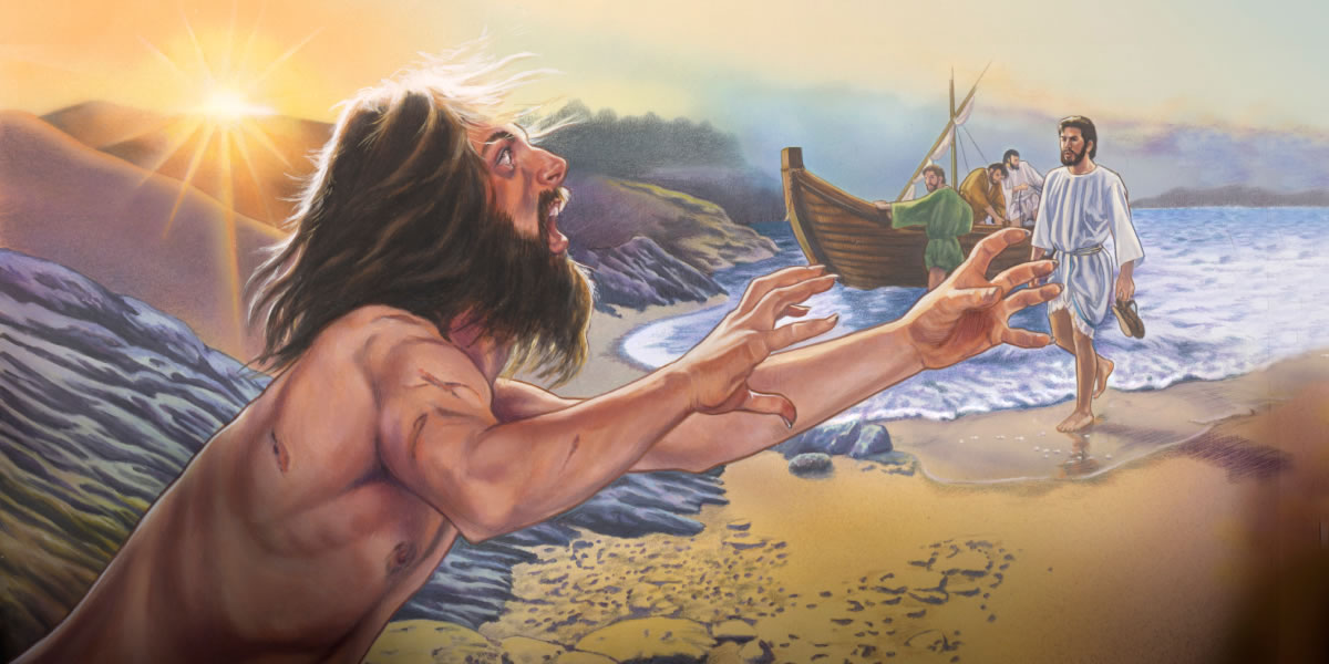 A man possessed by many demons approaches Jesus