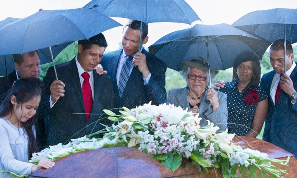 Christians showing empathy to fellow believers at a burial