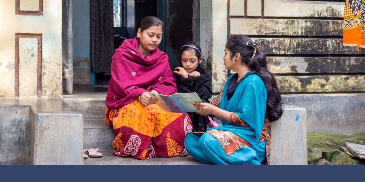 A sister preaches to a mother and daughter in the state of West Bengal in India