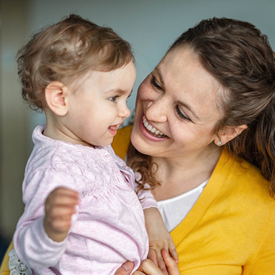 A mother holding her baby