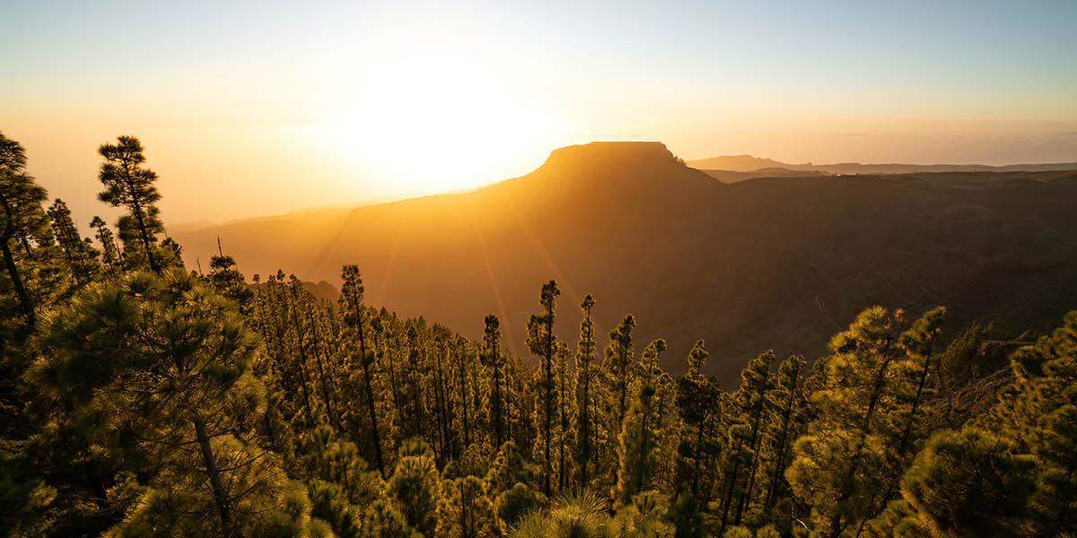 The sun rising over the mountains.