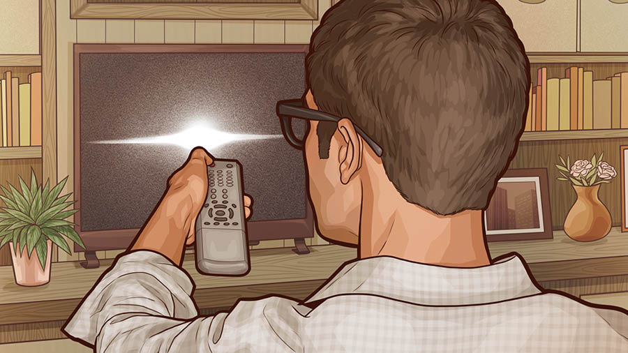 A young man turning off the television.