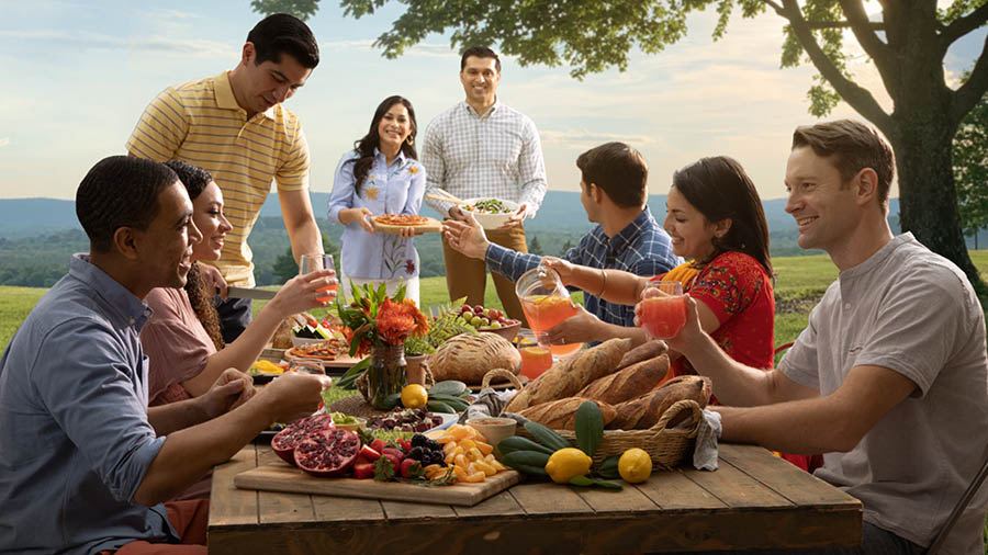 A group of friends in Paradise, enjoying a meal together.