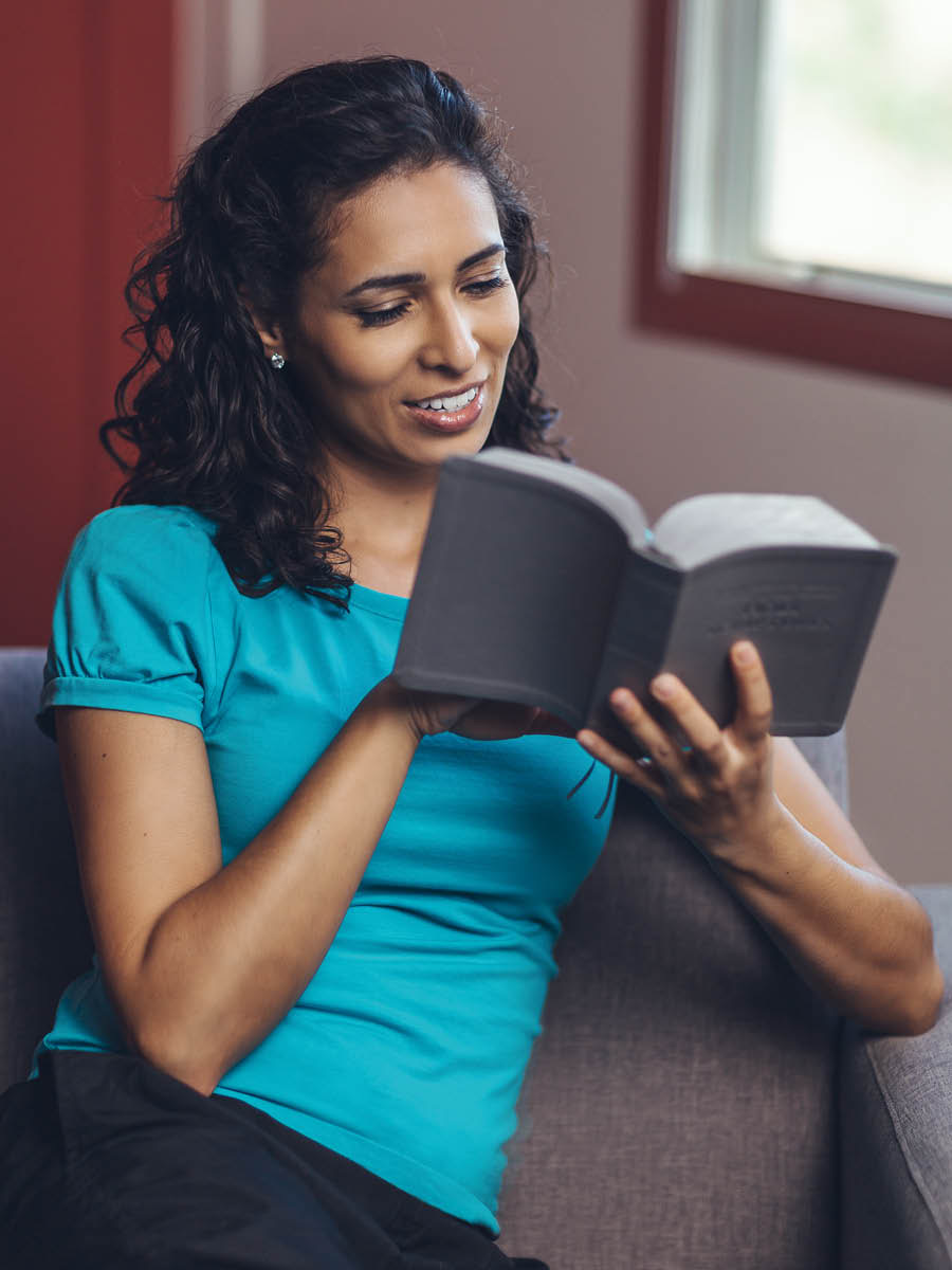 A woman reading the Bible.