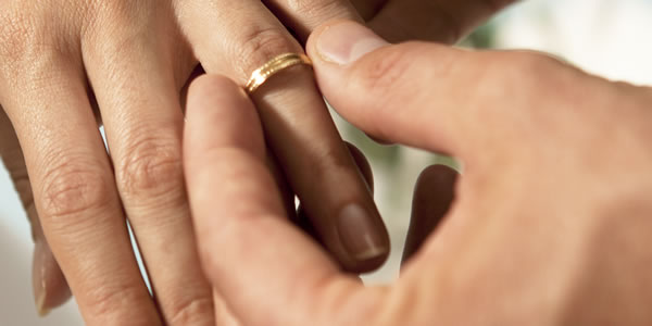 Hands of a bride and groom