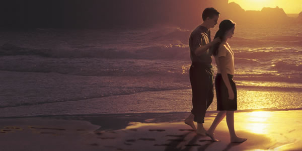 A couple walking on the beach