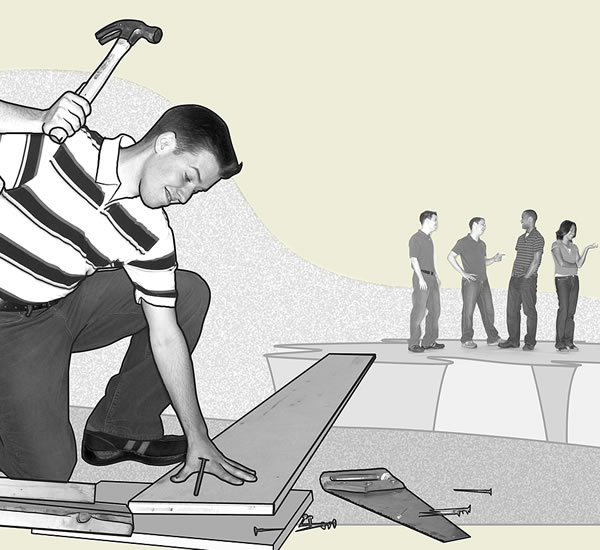 A teenage boy building a bridge