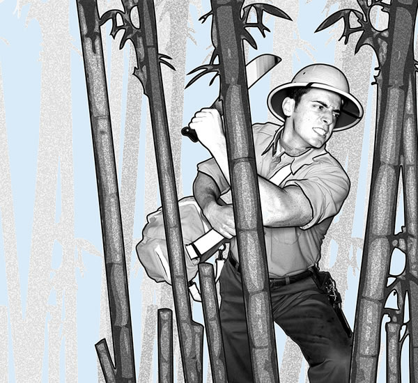 A man cutting his way through a dense jungle