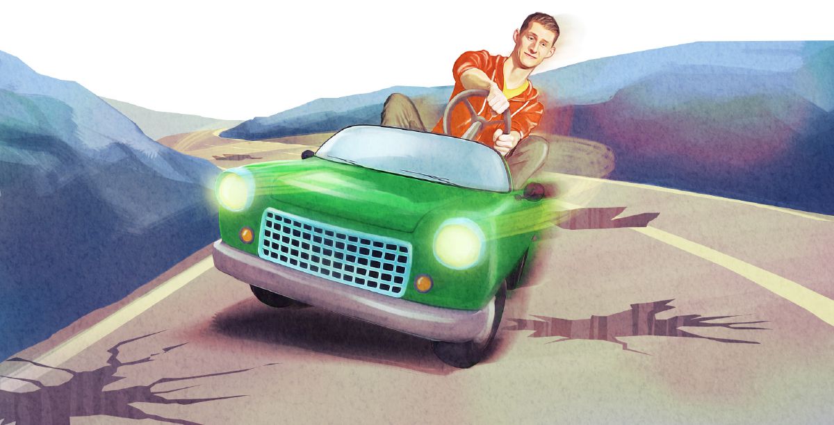 A young man tries to avoid potholes in a road