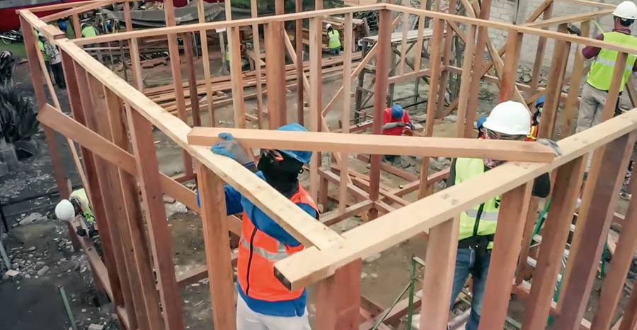 A scene from the video “2019 Coordinators’ Committee Report.” Brothers rebuild a home damaged by a natural disaster in Indonesia.