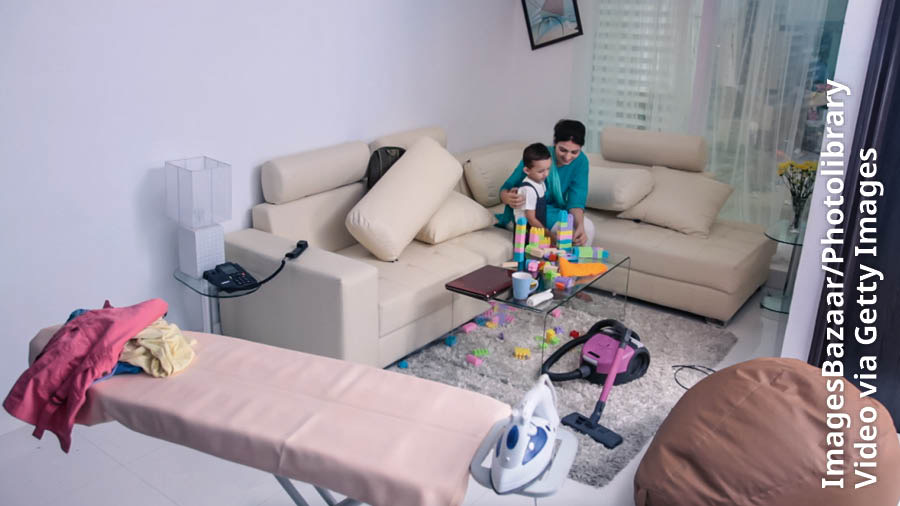 A scene from the video “My Teen Life​—How Can I Talk to My Parents?” A mother takes time from her household chores to play with her young son.