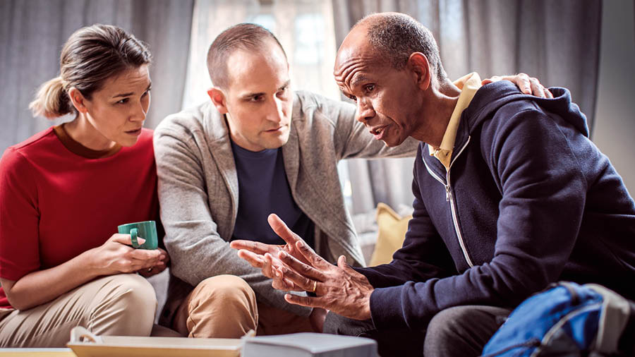 A couple listening to a brother in need.