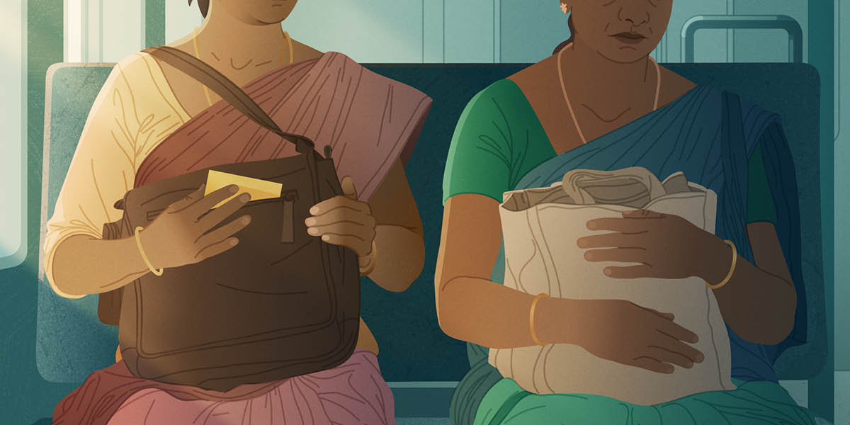 Two women sitting together on a passenger train.