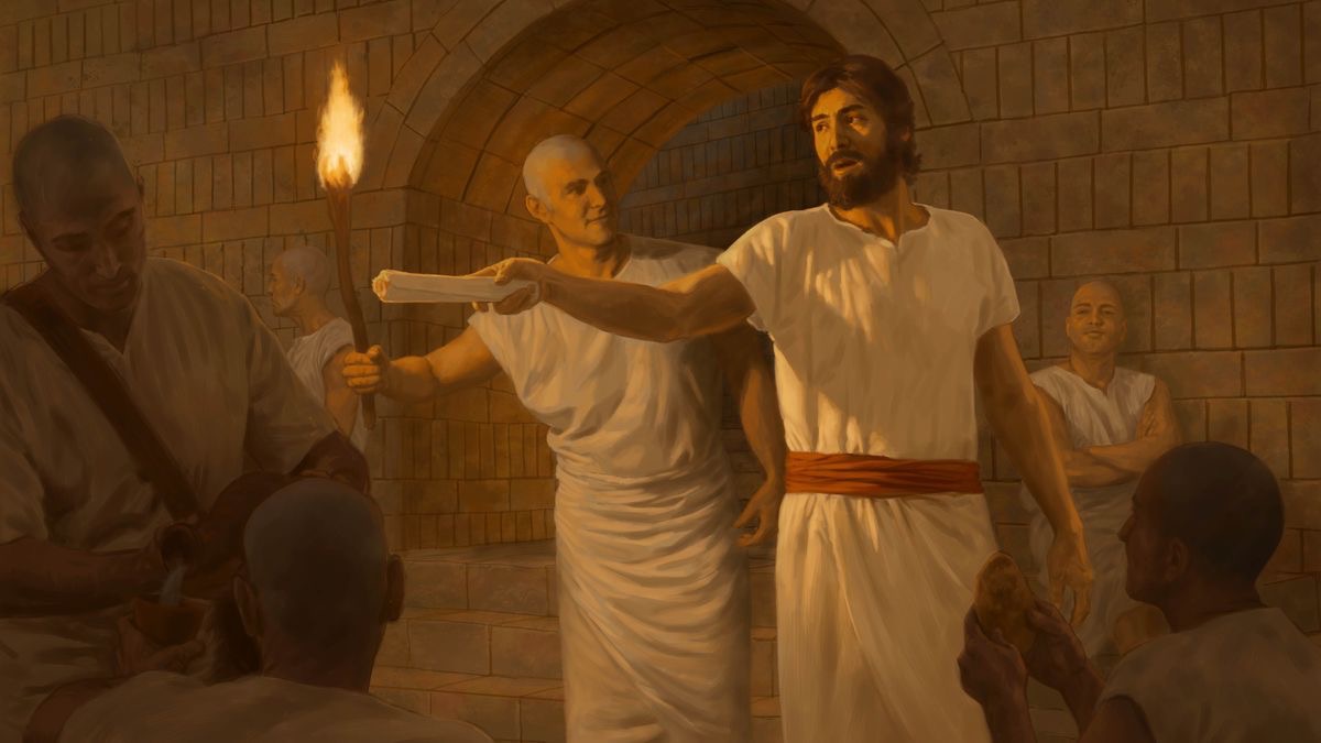 Joseph giving instructions to other prisoners.