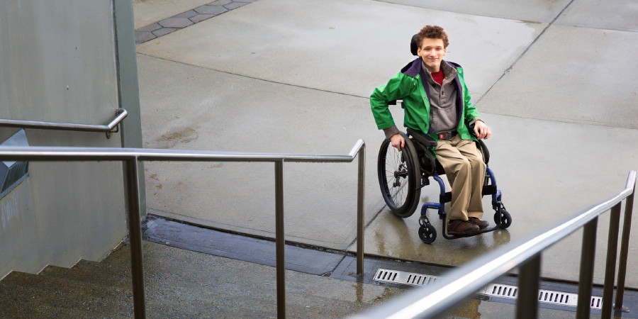 A teenage boy confined to a wheelchair