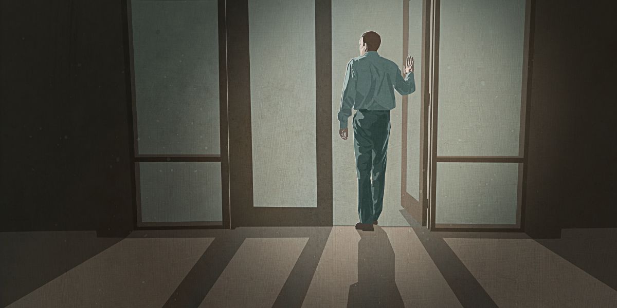 A man walks out of a Kingdom Hall