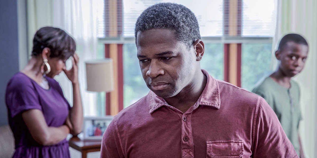 A father and mother disappointed in their teenage son.