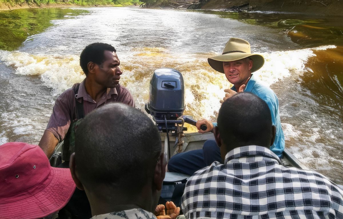 Warren steering a boat full of publishers.